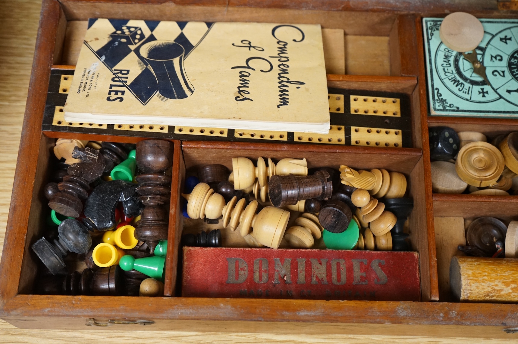 A wooden boxed games compendium, 33cm wide x 19.5cm deep